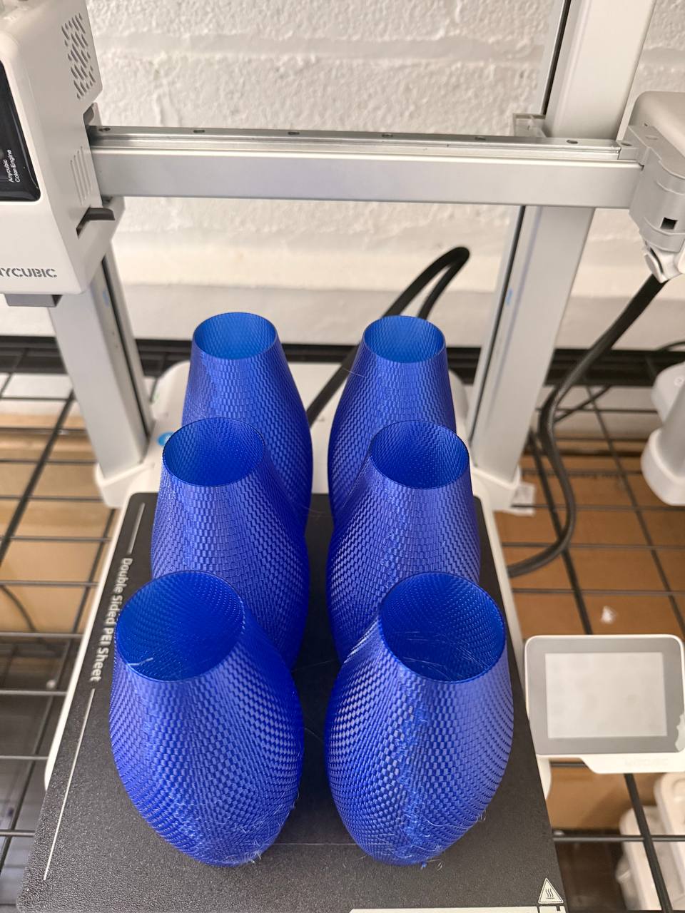 Six Sapphire vases fresh off the printer bed